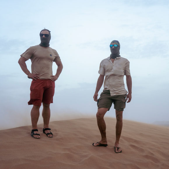 Ben and Michel wearing a snood in the desert