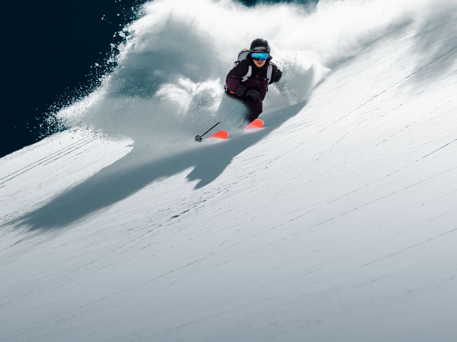 Skier skiing fast down the piste